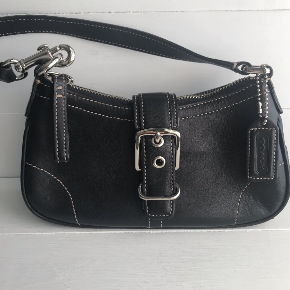 Coach Black Purse with buckle snap closure.